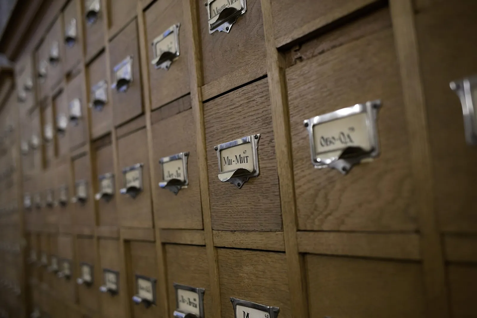 Rows of labelled wooden file drawers